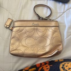 small gold coach wristlet 
