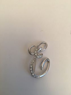 Beautiful silver tone E SIGN Brooch
