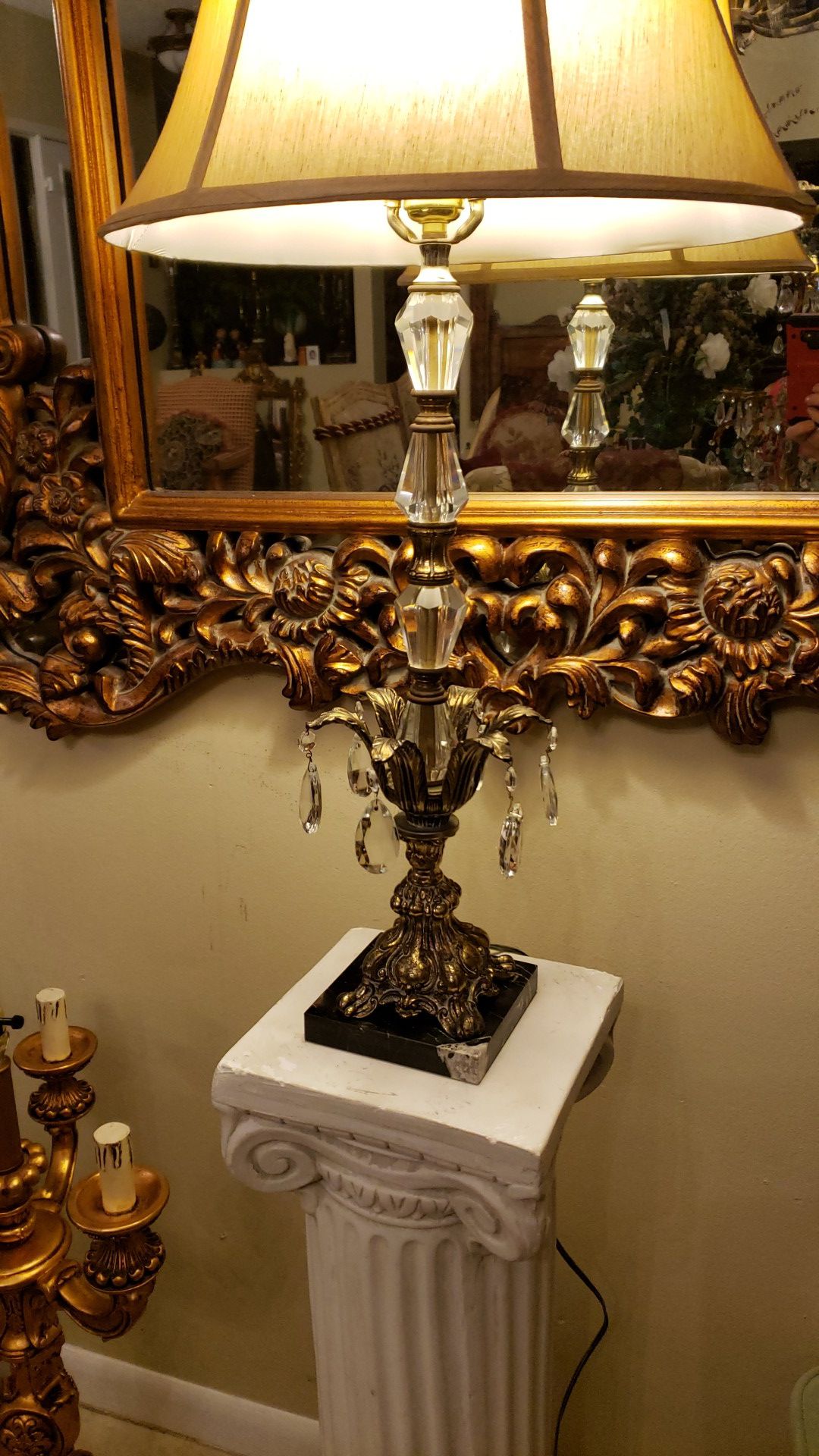 Beautiful antique Italian lamp with crystals on an elegant marble stand