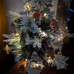 Tiny Flocked Battery Lighted Christmas Tree 26" Height With Gingerbread Looking Ornaments
Comes with fresh new batteries