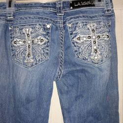 La idol Jean's bootcut 1s sparkly crosses on back pockets