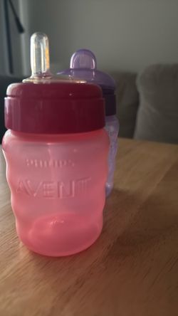 Purple and pink Philips Avent sippy cups