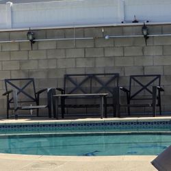 Iron outside low seat and chairs with the table.