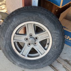 Brand New 235/70 R16 Tire with Jeep Rim