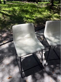 2 white bar stools