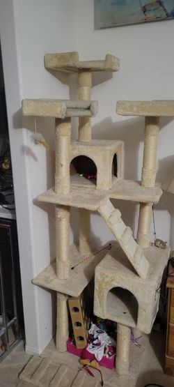 cat tree featuring several perches, condos, and scratching posts. Similar models are often referred to as the Purrsian Cat Tree Condo or the Armarkat