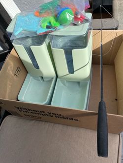 Pet food / water containers with fishing line with toys