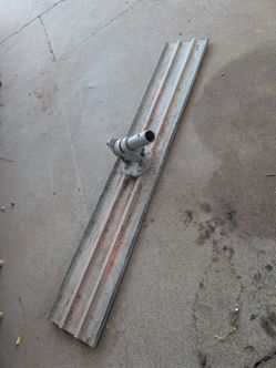 Bull float with swivel bracket and concrete rake