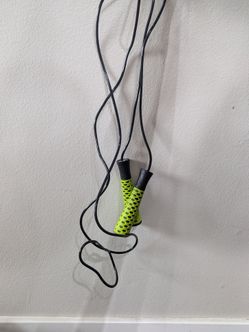 green plastic jump rope