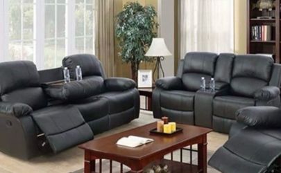 Black leather fully reclining couch and love seat