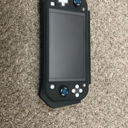 Nintendo Switch Lite(comes With Case And Caps For Joysticks)