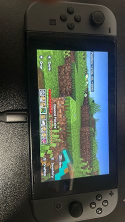 Nintendo switch scratched and comes with 2 games no charge price firm