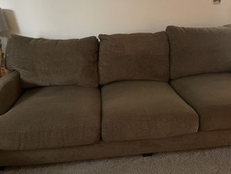 Brown couch and loveseat