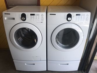 FRONT LOAD SAMSUNG WASHER AND GAS DRYER SET WITH PEDESTALS