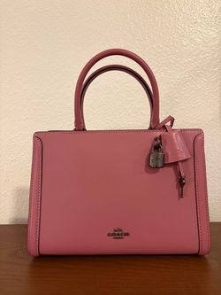 Pink Leather COACH top-handle satchel with a padlock