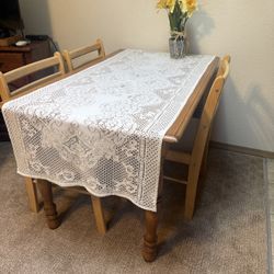 Wooden Table With Three Chairs