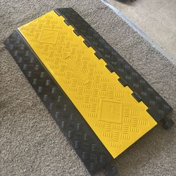 Speed bump/cable protector