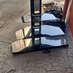 Nice swivel tv stand top 2 shelves glass bottom is wood laminate