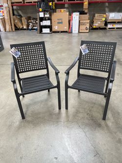 Pair of black steel stackable patio chairs