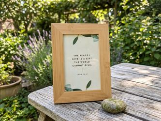 Bamboo tabletop picture frame containing a minimalist Christian scripture print
