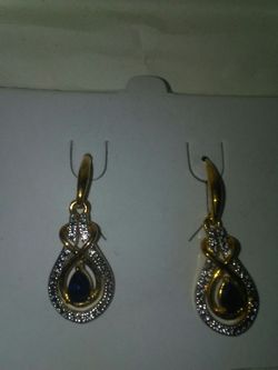 18 k over. Earring. Real stone