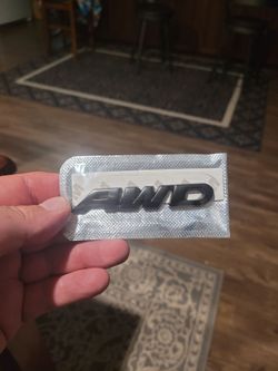 New black emblem AWD metal.