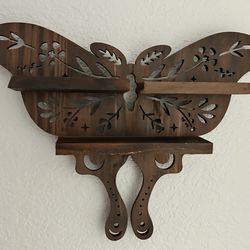 Wooden butterfly shelf.