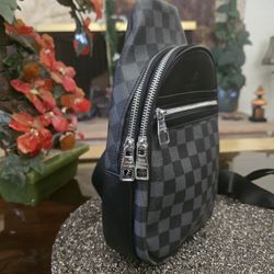 Bag Louis Vuitton For Men, & Women, The Avenue Slingbag is made from Damier Graphite canvas with a Louis Vuitton leather patch on the front 