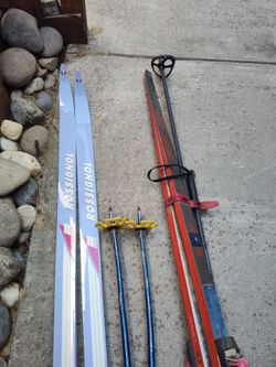Rossignol and Fischer skiis with poles