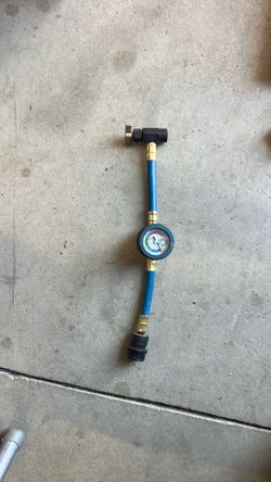 Ac refrigerant charging hose.