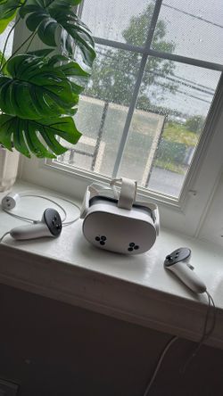 Meta quest 3S with charger and remotes