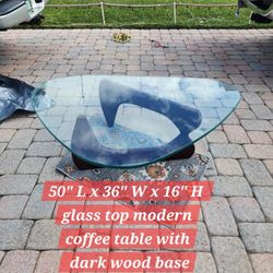 50" L x 36" W x 16" H  Modern Glass Coffee Table With Dark Wood Base50" L x 36" W x 16" H  Modern Glass Coffee Table With Dark Wood Base