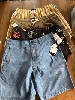 4 Men’s shorts/ swim shorts size medium