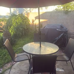 Outdoor patio set. Table, 4 chairs, folding umbrella with lights.