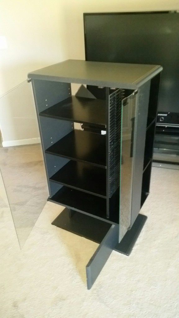 Stereo system cabinet with cd/DVD disc rack and bottom storage compartment