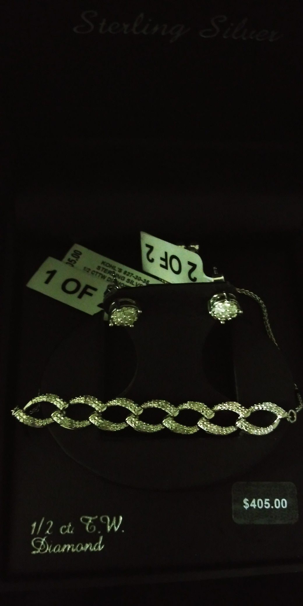 Brand new still in box diamond earrings and bracelet