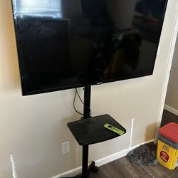 40" Samsung TV with Rolling Stand And Fire Stick