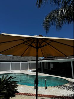 Outdoor umbrella with stand