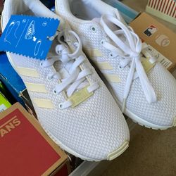 New never worn Adidas white shoes, size 2