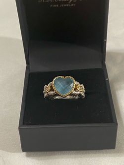 Brand new 18 karat gold & .925 silver ring with real diamonds and heart shaped aquamarine. Size 7.