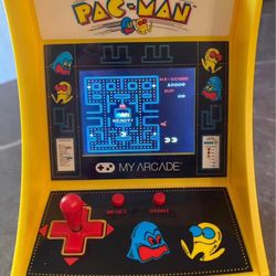 Pac-Man arcade machine by My Arcade.  Approx size 7 inches high by 5 inches wide. 