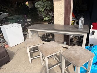 Counter height table with stools
