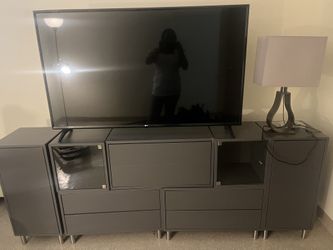 Two Mirror Dresses, long gray dresser, and TV