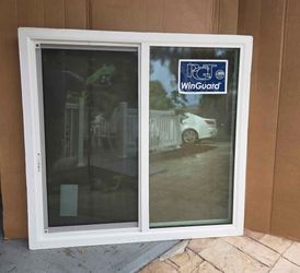 Brand New 49W x 57H PGT Impact Vinyl Sliding Window