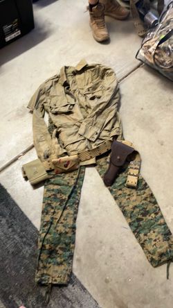 Camo pants and field jacket with military supplies