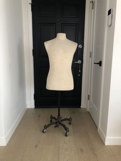 Male suit form on adjustable metal stand with casters