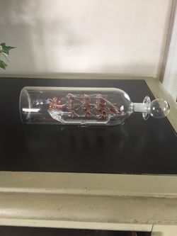 Glass sail boat in a bottle