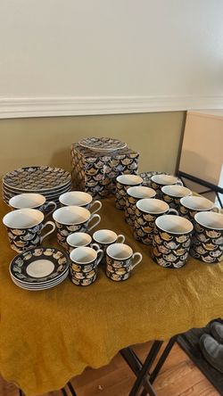 40 pieces vintage Department 56 "Tea Leaves" pattern ceramic mugs and matching small plates featuring a colorful miniature teapot motif on a dark back