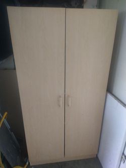 Tall cabinet. 4 compartments. 59 1/2" h, 29 3/4" w, 15 1/2" d . Can deliver