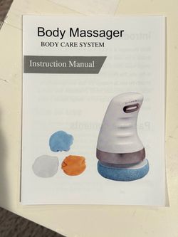 New in Box Body Massager Body Care System / Body Sculpting Machine New handheld body massager with a soft dual padded head. This device has a pink a